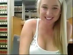 Cute blonde masturbates in library